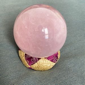 Pink rose quartz crystal sphere.